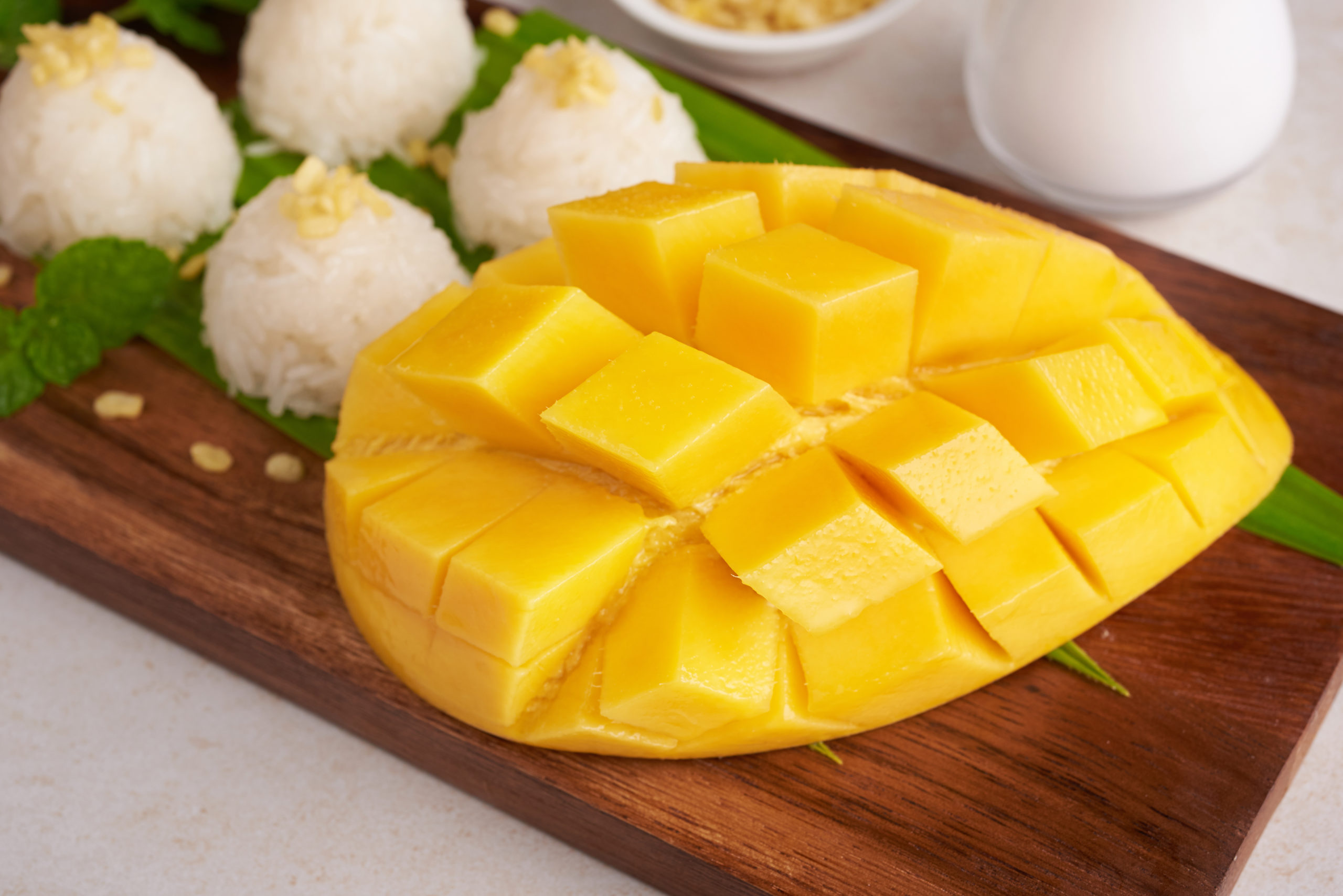 ripe mango sticky rice with coconut milk wood plate stone surface tropical fruit dessert fruit thai sweet dessert summer season scaled